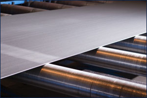 Continuous sheet of sheet metal fed through machine